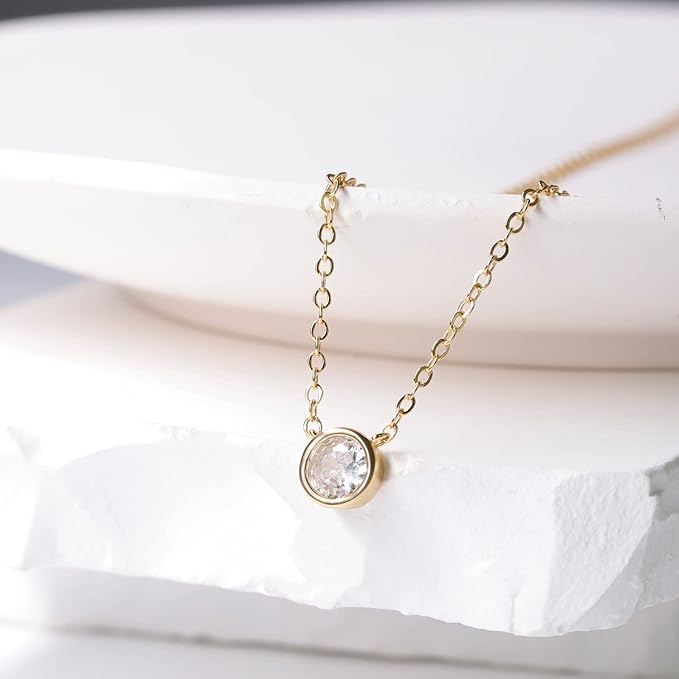 they emit a mesmerizing shimmer that captures the attention of all who behold them.4K Gold/White Gold Plated Round Teardrop Single Solitare