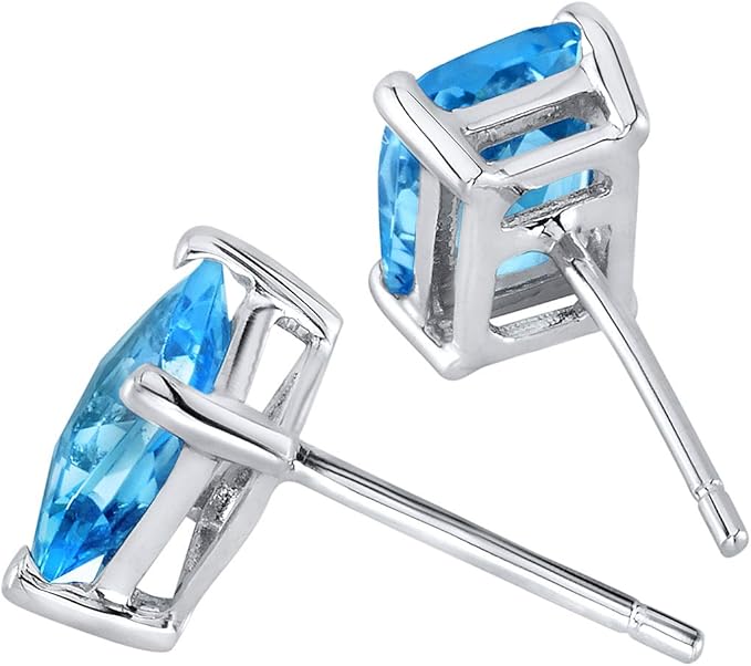 Set in a classic 4-prong 14K White Gold Earring solitaire style, 7x5mm Radiant Cut, 2.25 Carats total, Swiss Blue Topaz Earrings for Women, Genuine