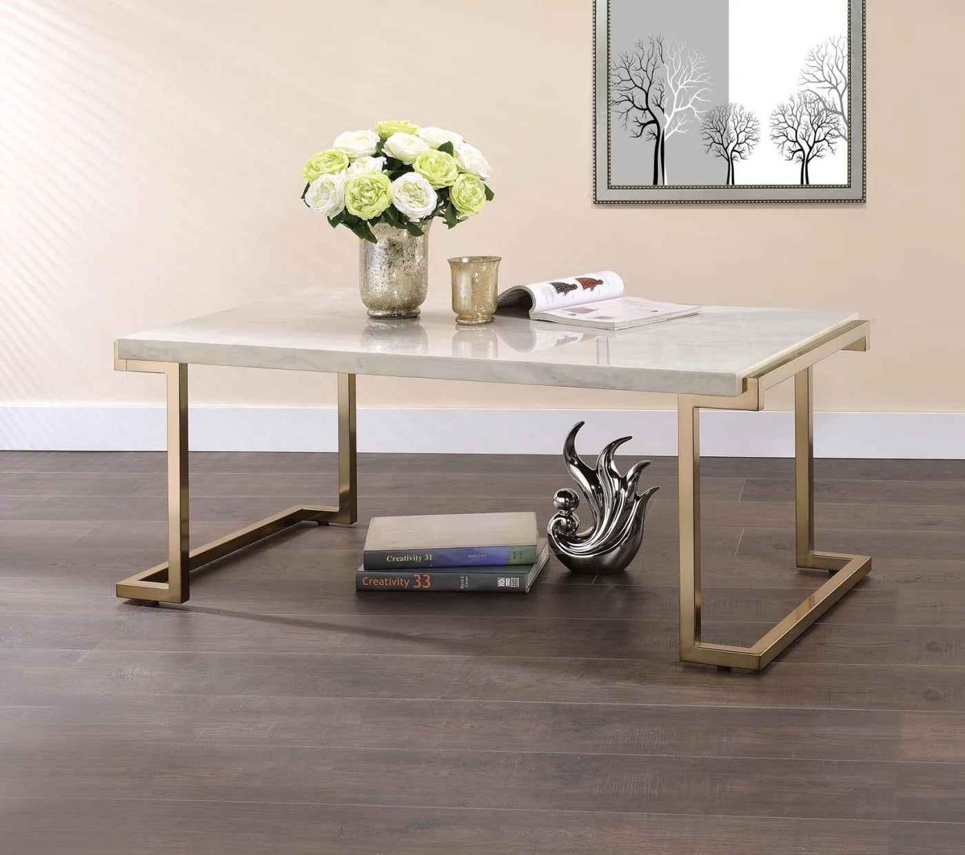 The modern lines of the base with its open return base and simple form top,  Marble Look Coffee Table